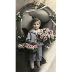 Gelukkig Nieuwjaar. Jongetje met hoefijzer,bloemen.Rond 1920