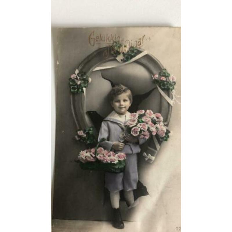 Gelukkig Nieuwjaar. Jongetje met hoefijzer,bloemen.Rond 1920